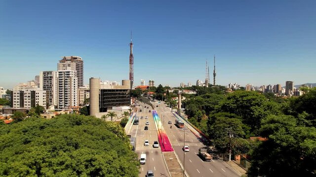 Panning wide of colorful Sumare bridge at downtown Sao Paulo Brazil. Stunning landscape of landmark avenue of city. Urban aerials.