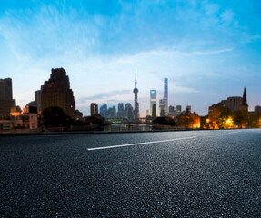 Asphalt road High way Empty curved road clouds and sky at sunset