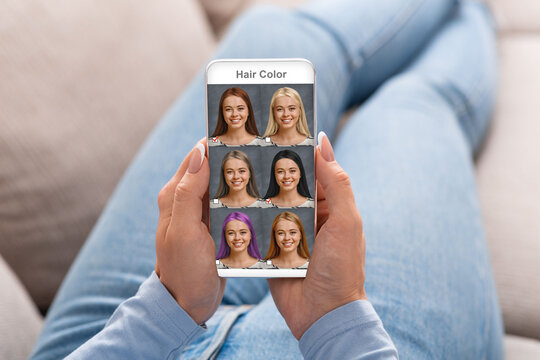 Beautiful woman checking hair color simulation mobile application on smartphone