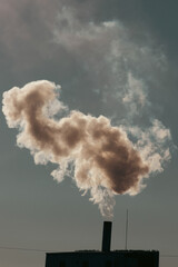 Smoke coming out of factory chimney.