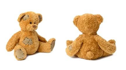 Fotobehang cute brown teddy bear isolated on white background, sitting back and sideways © nndanko