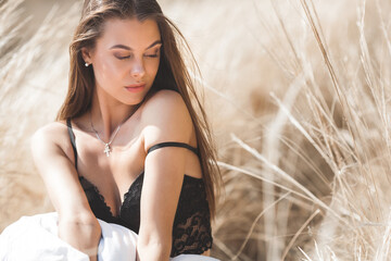 Closeup portrait of young beautiful woman outdoors. Attractive female on neutral background.