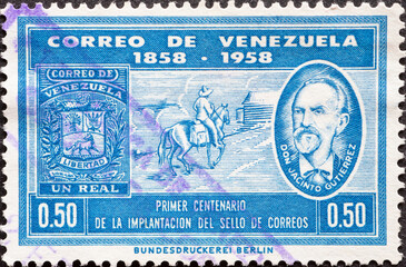 Venezuela - circa 1959: a postage stamp from Venezuela, showing a Mailman on horseback and Jacinto Gutierrez