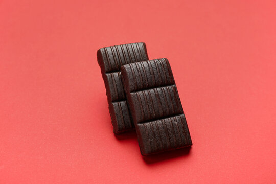 Delicious and healthy hematogen on pink background