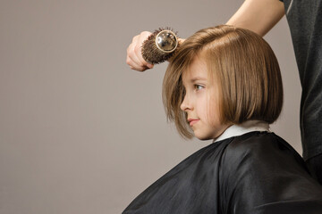 Bob Short Hairstyle. Beautiful Hair of Little Girl. Fashion Trendy Haircut. Dark Blond Child Model...