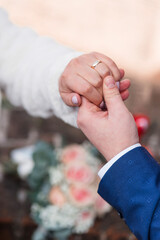 bride and groom holding hands