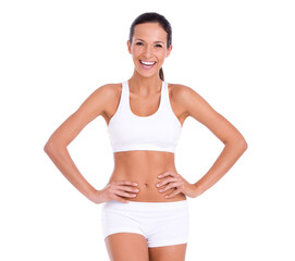 Staying fit isn't always serious. Studio portrait of an attractive woman in exercise clothing isolated on white.