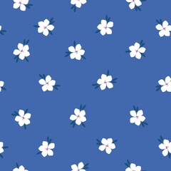 Beautiful vintage pattern. White flowers, dark blue leaves, blue background. Floral seamless background. An elegant template for fashionable prints.