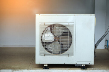 Outdoor air condition  unit compressor install outside house's wall. Concept: appliance for office...