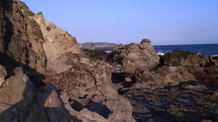 Fototapeta na wymiar The edge of the Cliff Beach which is dominated by coral rocks that are gripping but still amazing