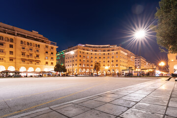 Fototapeta na wymiar view of main tourist attraction of Thessaloniki - Aristotle Square with cafes and hotel buildings. Travel, life and real estate in Greece and Macedonia region concept