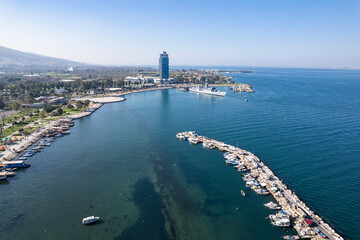 Fototapeta premium Inciralti District coastal and Ozdilek Wyndham Otel view in Izmir City. inciralti has recretional area and fishing boats in Izmir.