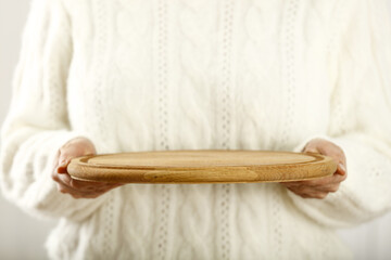 wooden tray and woman hands 
