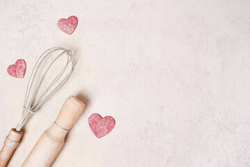 Valentine's Day Baking background. pink Hearts with rolling pin, copy space