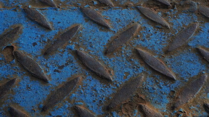 blue scrap metal that has started to fade