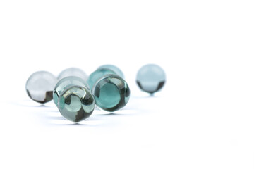 Soft focus on glass balls with reflections and shadows.