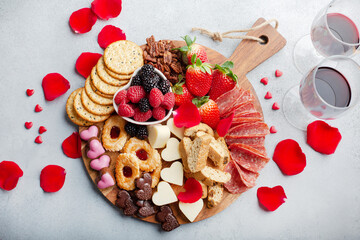 Cheese plate for Valentines day with snacks and fruit