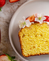 Strawberry and cream cheese summer cake on white marble board. Homemade summer dessert in spring decoration. brunch ideas. easter dessert.