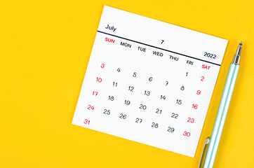 July 2022 calendar on yellow background.