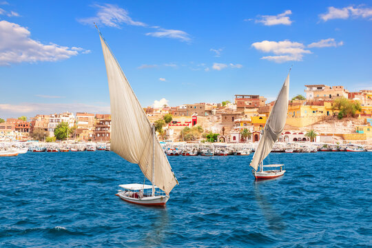 Feluccas On The Nile Near Egyptian Village, Aswan, Egypt