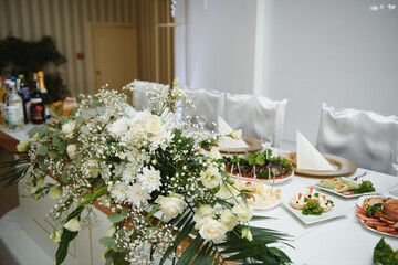 beautifully laid tables with glasses and appliances at morning in restaurant