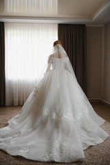 Fototapeta premium Bride dressing wedding gown. morning bride