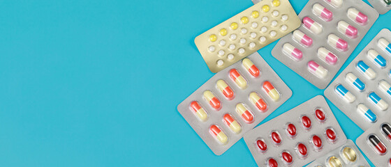 close up pharmaceuticals antibiotics pills medicine in blister packs. colorful antibacterials pills Pharmacy background. capsule pill medicine Antimicrobial drug resistance. Pharmaceutical industry