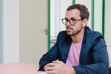 Fototapeta premium adult man sitting with crossed arms on the table at business meeting