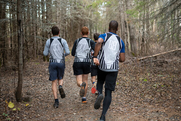 boys running in the woods