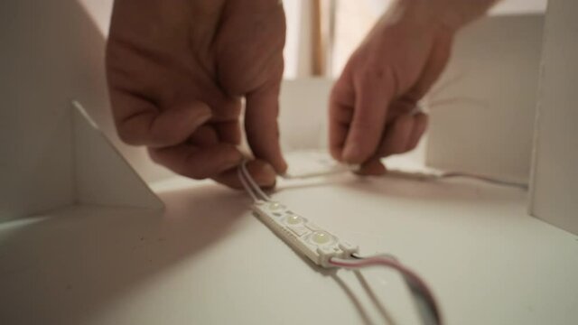 Production of advertising signs with backlit LED strip