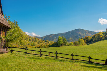Fototapeta na wymiar Early autumn in the Carpathian Mountains. Surroundings of the village of Vlkolinec. Rural landscape from Slovakia. Pasture fence on a sunny day.