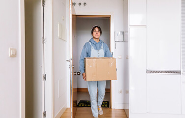 Young female moving in new apartment
