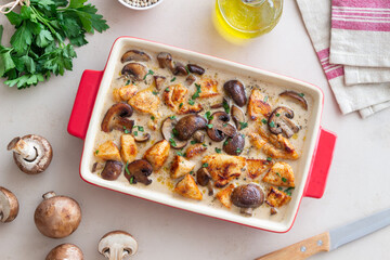 Baked chicken and mushrooms in a creamy sauce. French cuisine. Fricassee.