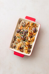 Baked chicken and mushrooms in a creamy sauce. French cuisine. Fricassee.