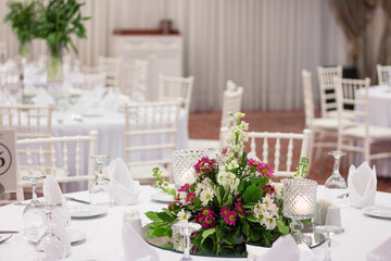 wedding table decoration with fresh colorful flowers and candles