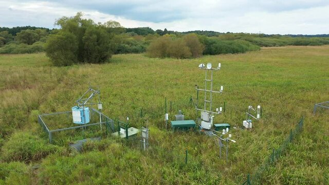 Wetlands science station research for studying meadows, drone aerial video shot ecosystem weather station swamp willows cycle carbon flux eddy covariance methane research physiological photosynthesis