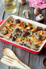 Baked chicken and mushrooms in a creamy sauce. French cuisine. Fricassee.