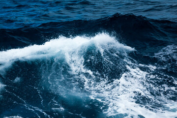 Ocean water background with foam. Ocean water splash. Not a calm 