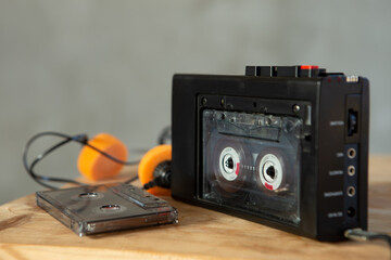 Obraz premium Music listening concept. Vintage cassette tape, audio player and headphones.
