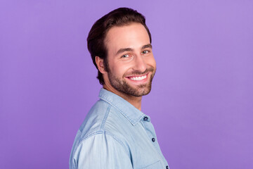 Profile side portrait of cheerful young guy smiling visit barbershop perfect hairstyle isolated on violet color background