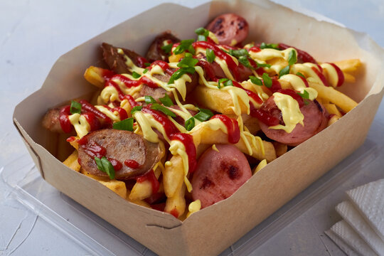 salchipapa, salchipapas traditional street food from Peru with sausages and french fries