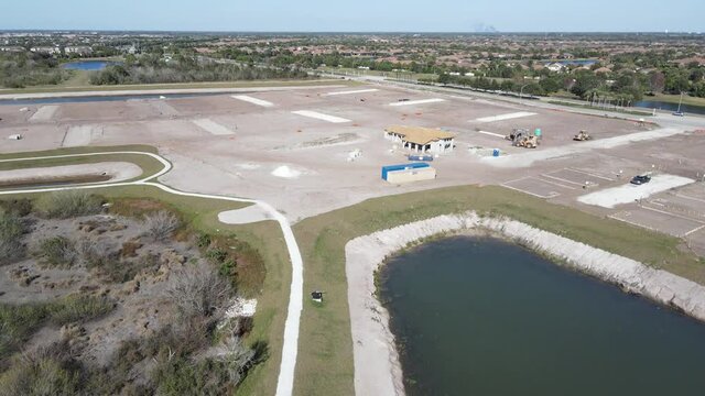 orbiting aerial of the only home built so far in a large South Florida home development area