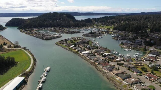 Cinematic pan shot of Shelter Bay, Swinomish Village, Swinomish Channel and La Conner on a native American indian tribal reservation in Washington