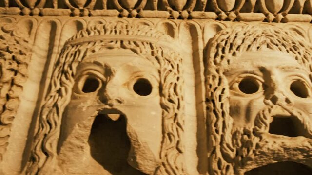Antique bas-relief Mask face