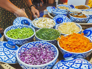 Close up to Vegetables and fruits and various food ingredients for cooking delicious Thai Southern Spicy Rice Salad with Vegetable. Thai cuisine, Popular Thai southern food. Selective focus.