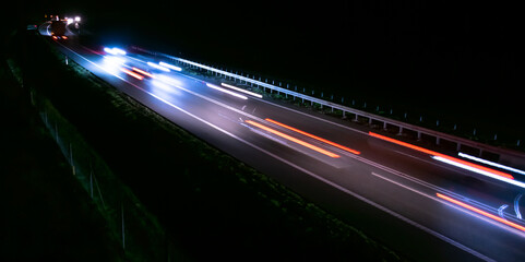 Fototapeta na wymiar abstract red car lights at night. long exposure