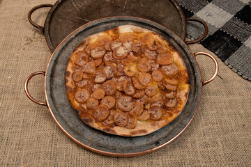 Sweet Brazilian pizza with banana, cinnamon and sugar