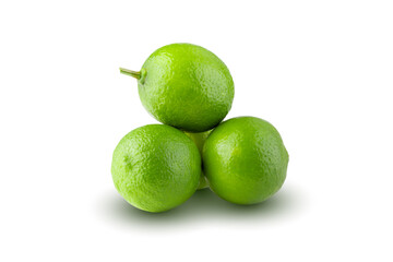 Whole and sliced limes, Sour green fruit isolated on a white background