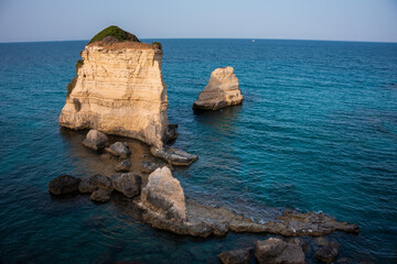 Fototapeta premium Beautiful rocky sea coast in Italy with clear water and stacks