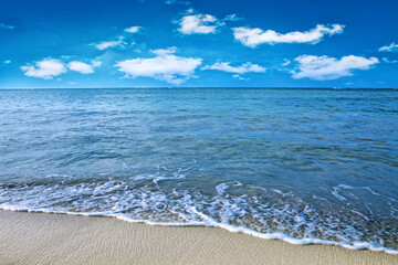 Beautiful caribbean sea and blue clouds sky. Travel background.